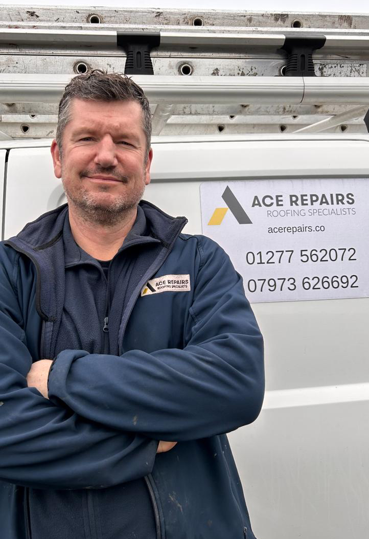 Neal Badger, Roofing Director at Ace Repairs, in front of the company van